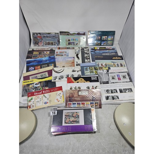 16 - A collection of First day covers and stamps all in sealed packets covering various subjects to inclu... 