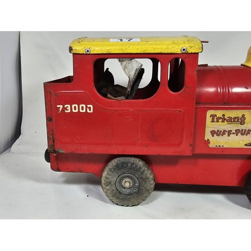 17 - A Tri-ang 'Puff-Puff' lithographed tin plate push along locomotive, red and ye;ow livery with a cart... 