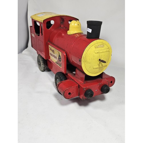 17 - A Tri-ang 'Puff-Puff' lithographed tin plate push along locomotive, red and ye;ow livery with a cart... 