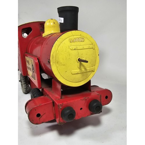 17 - A Tri-ang 'Puff-Puff' lithographed tin plate push along locomotive, red and ye;ow livery with a cart... 