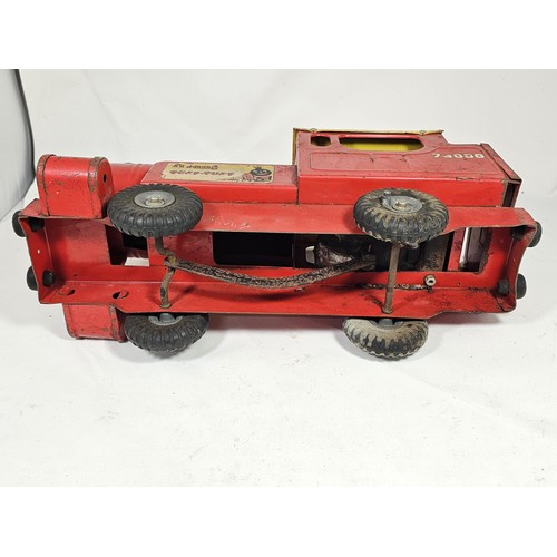 17 - A Tri-ang 'Puff-Puff' lithographed tin plate push along locomotive, red and ye;ow livery with a cart... 