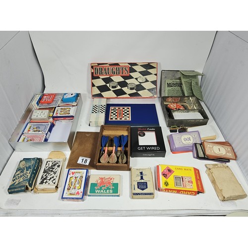 18 - A Collection of vintage games to include a tin containing a vintage Monopoly game dating from the 19... 