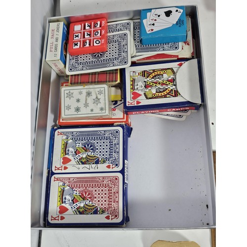 18 - A Collection of vintage games to include a tin containing a vintage Monopoly game dating from the 19... 