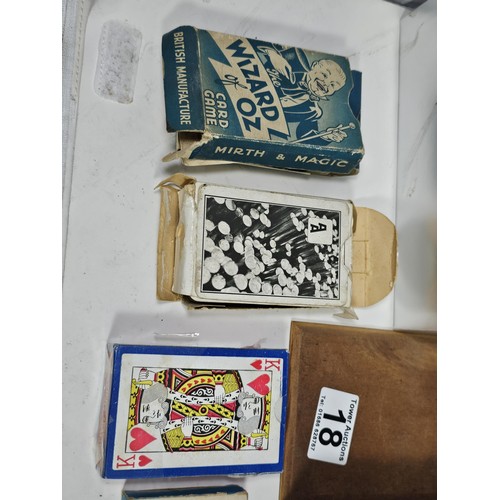 18 - A Collection of vintage games to include a tin containing a vintage Monopoly game dating from the 19... 