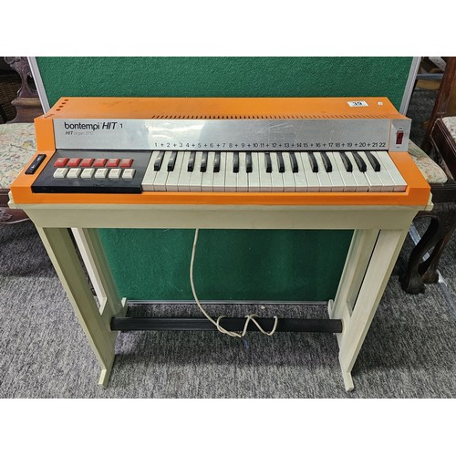 44 - A vintage Bontempi Hit 1 'Hit Organ' electronic organ in an orange and cream plastic casing, model n... 