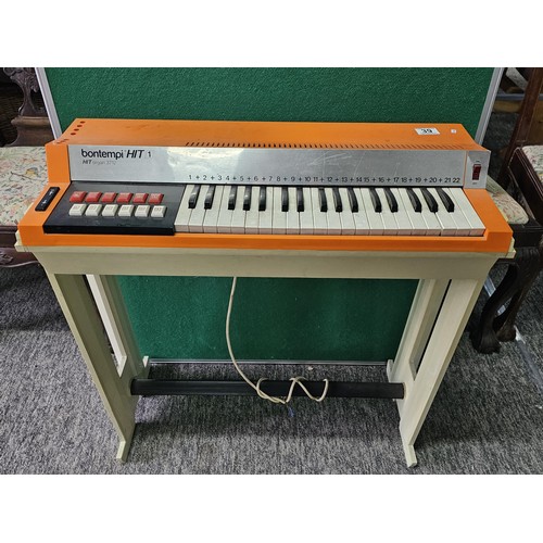 44 - A vintage Bontempi Hit 1 'Hit Organ' electronic organ in an orange and cream plastic casing, model n... 