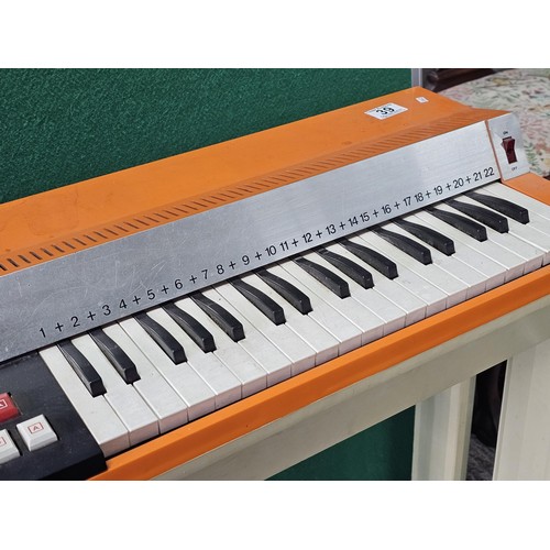44 - A vintage Bontempi Hit 1 'Hit Organ' electronic organ in an orange and cream plastic casing, model n... 