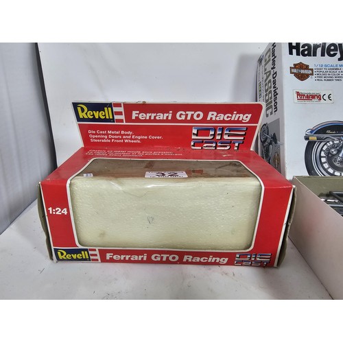 32 - A boxed Harley Davidson 1/12 scale model kit by IMAI, appears complete, along with a Revell Ferarri ... 