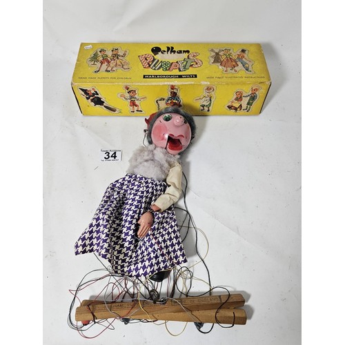 34 - An original boxed Pelham Puppet, the puppet is in traditional attire, the puppet requires attention,... 