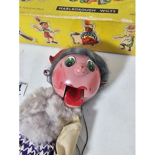 34 - An original boxed Pelham Puppet, the puppet is in traditional attire, the puppet requires attention,... 