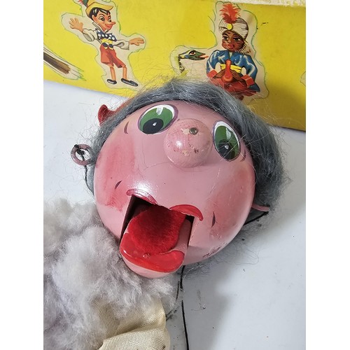 34 - An original boxed Pelham Puppet, the puppet is in traditional attire, the puppet requires attention,... 
