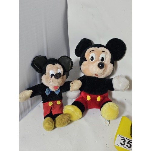 35 - A collection of Mickey Mouse items to include a genuine Disney Mickey mouse plush toy with label, a ... 