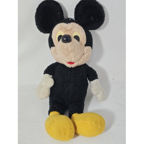 35 - A collection of Mickey Mouse items to include a genuine Disney Mickey mouse plush toy with label, a ... 