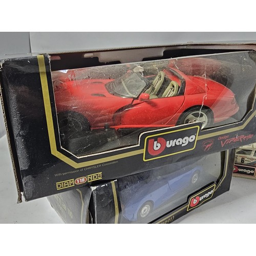 38 - 4x boxed 1/18 scale Burago diecast cars and a 1/43 Burago car. to include a Mercedes SSK, A lamborgh... 