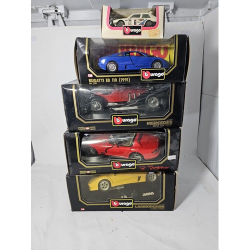 38 - 4x boxed 1/18 scale Burago diecast cars and a 1/43 Burago car. to include a Mercedes SSK, A lamborgh... 