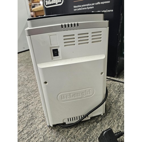 39 - A DeLonghi coffee machine, complete with coffee bean dispenser, cappuccino frother, with digital dis... 