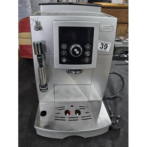 39 - A DeLonghi coffee machine, complete with coffee bean dispenser, cappuccino frother, with digital dis... 