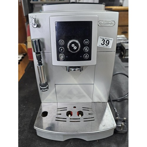 39 - A DeLonghi coffee machine, complete with coffee bean dispenser, cappuccino frother, with digital dis... 