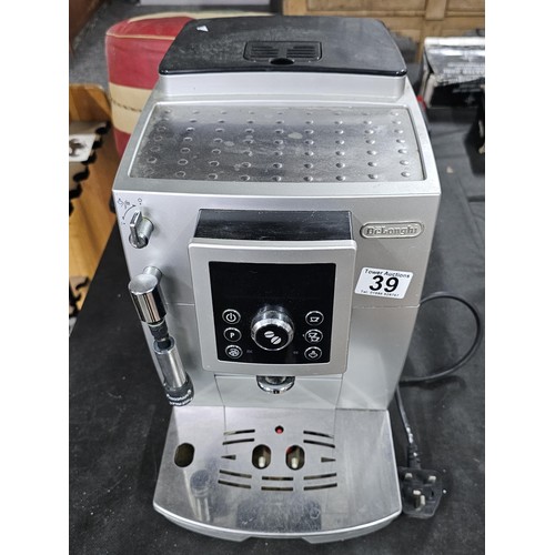 39 - A DeLonghi coffee machine, complete with coffee bean dispenser, cappuccino frother, with digital dis... 