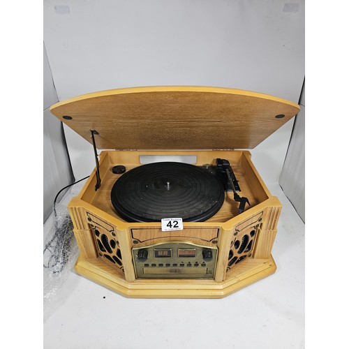 42 - A reproduction record player in a wooden case, fitted with a CD player and radio, in full working or... 