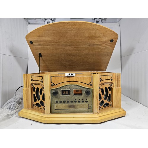 42 - A reproduction record player in a wooden case, fitted with a CD player and radio, in full working or... 