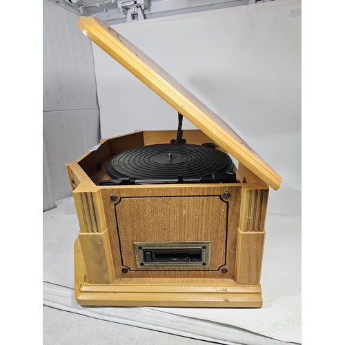 42 - A reproduction record player in a wooden case, fitted with a CD player and radio, in full working or... 