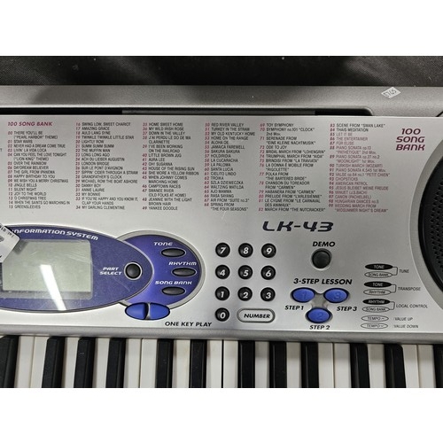 43 - A Casio keyboard model LK-43 with 100 preset tones and 50 rhythm, complete with digital display to t... 
