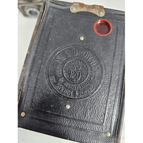 47 - A collection of 3 antique cameras, to include a Vario concertina camera, a cased number 2 Brownie ca... 