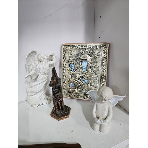 53 - 2 shelves containing a collection of religious related items, to include 11 Russian style iconograph... 