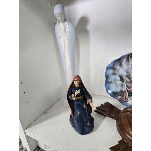 53 - 2 shelves containing a collection of religious related items, to include 11 Russian style iconograph... 