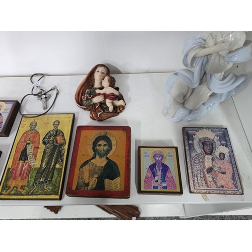 53 - 2 shelves containing a collection of religious related items, to include 11 Russian style iconograph... 