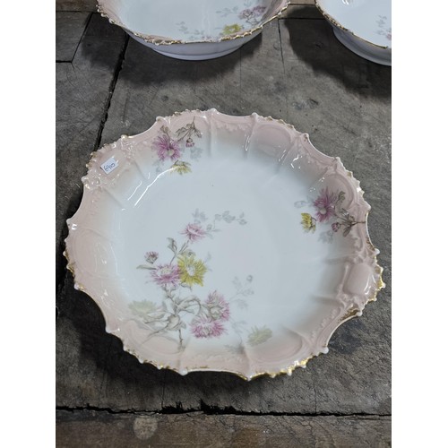 55A - A part set of early 20th century Limoges porcelain comprising of 10 hand painted cabinet plates and ... 