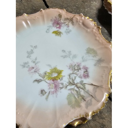 55A - A part set of early 20th century Limoges porcelain comprising of 10 hand painted cabinet plates and ... 