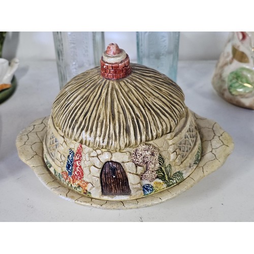 55 - A shelf full of collectables to include, a James Kent floral butter dish, a hand painted Belgium vas... 