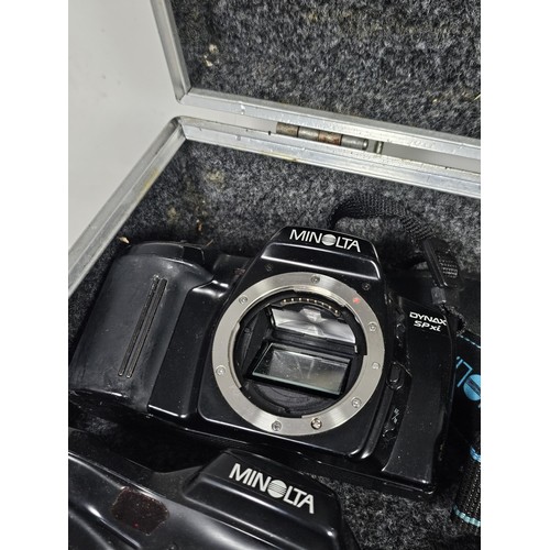 A aluminum camera case containing a quantity of 6x assorted camera ...