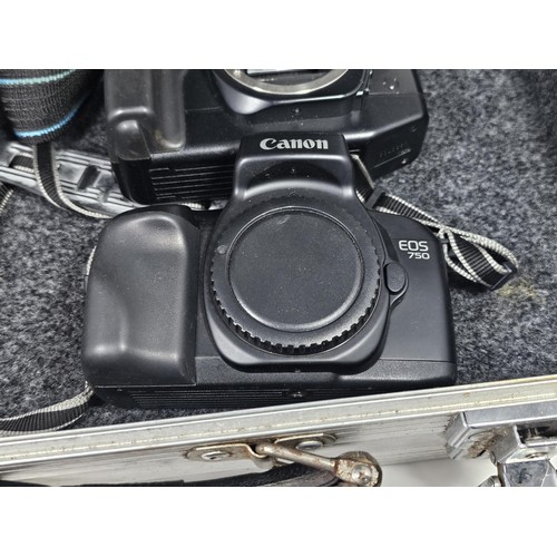 A aluminum camera case containing a quantity of 6x assorted camera ...