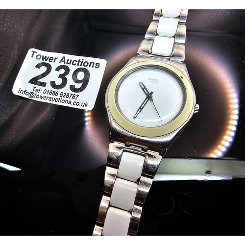 216 - A good quality Swatch Swiss Irony ladies wristwatch having a clean white dial with a cream Bezel and... 
