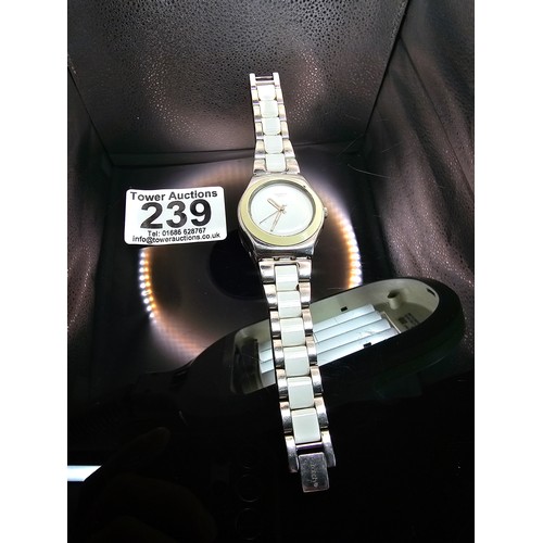 216 - A good quality Swatch Swiss Irony ladies wristwatch having a clean white dial with a cream Bezel and... 