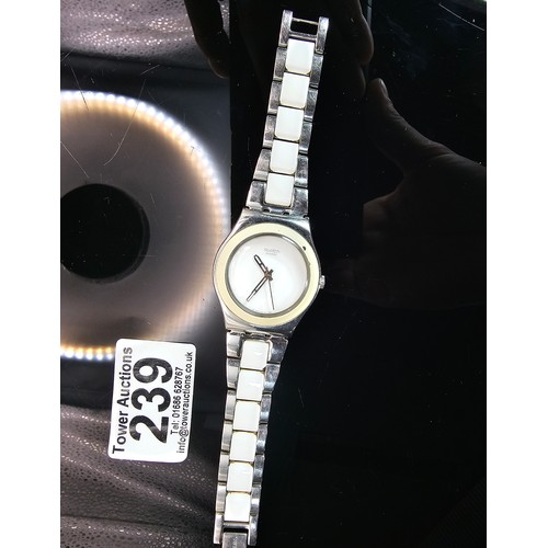 216 - A good quality Swatch Swiss Irony ladies wristwatch having a clean white dial with a cream Bezel and... 