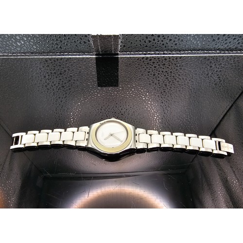 216 - A good quality Swatch Swiss Irony ladies wristwatch having a clean white dial with a cream Bezel and... 