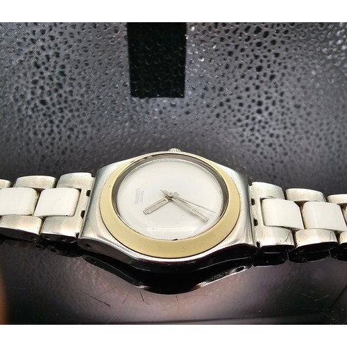 216 - A good quality Swatch Swiss Irony ladies wristwatch having a clean white dial with a cream Bezel and... 