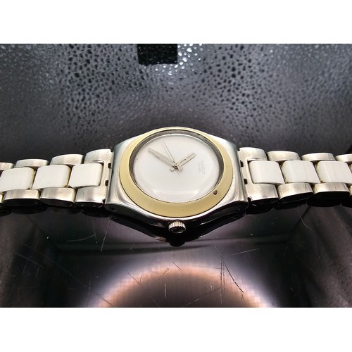 216 - A good quality Swatch Swiss Irony ladies wristwatch having a clean white dial with a cream Bezel and... 