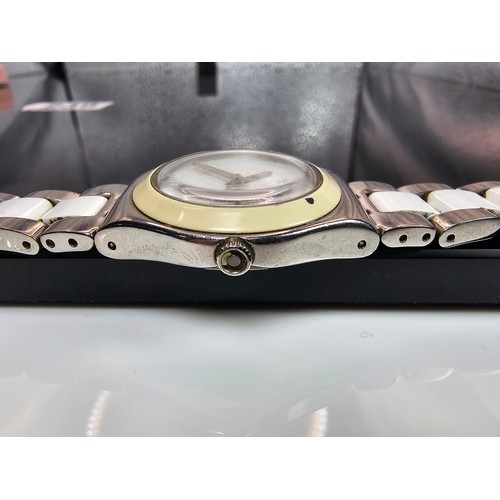 216 - A good quality Swatch Swiss Irony ladies wristwatch having a clean white dial with a cream Bezel and... 
