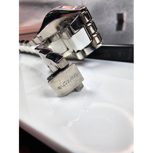 216 - A good quality Swatch Swiss Irony ladies wristwatch having a clean white dial with a cream Bezel and... 
