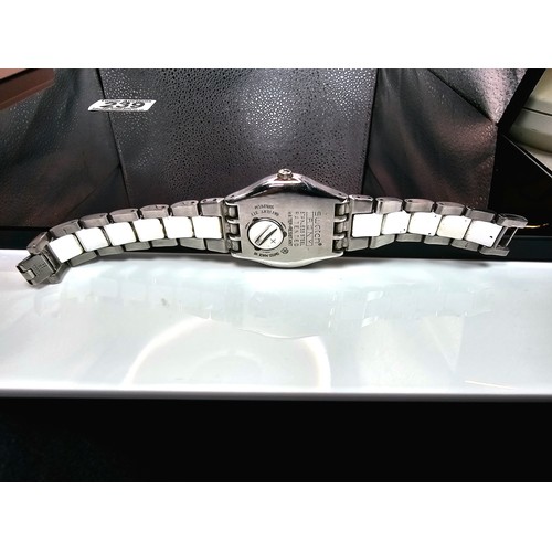 216 - A good quality Swatch Swiss Irony ladies wristwatch having a clean white dial with a cream Bezel and... 
