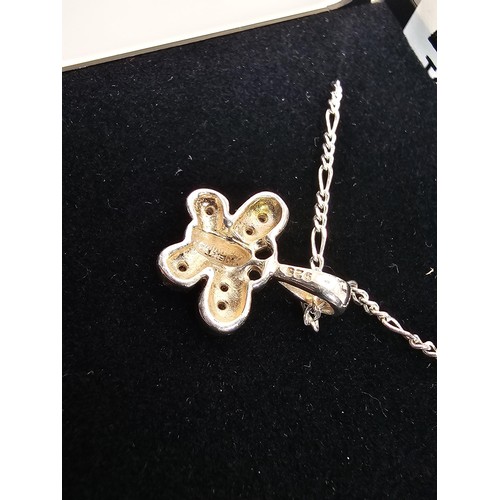 226 - A pretty 925 silver pendant and necklace featuring a silver butterfly pendant set with small CZ ston... 