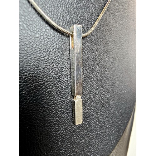 215 - A 925 silver pendant necklace featuring a bar formed silver pendant set with a real round cut diamon... 