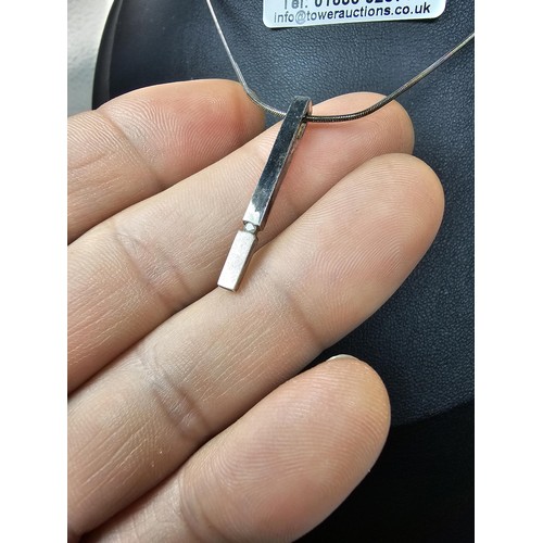 215 - A 925 silver pendant necklace featuring a bar formed silver pendant set with a real round cut diamon... 