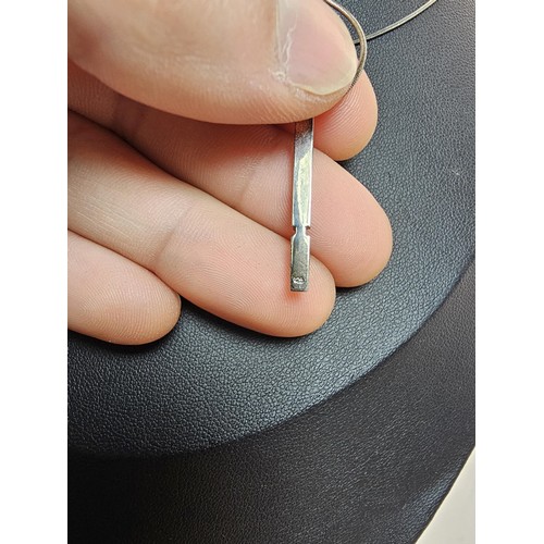 215 - A 925 silver pendant necklace featuring a bar formed silver pendant set with a real round cut diamon... 