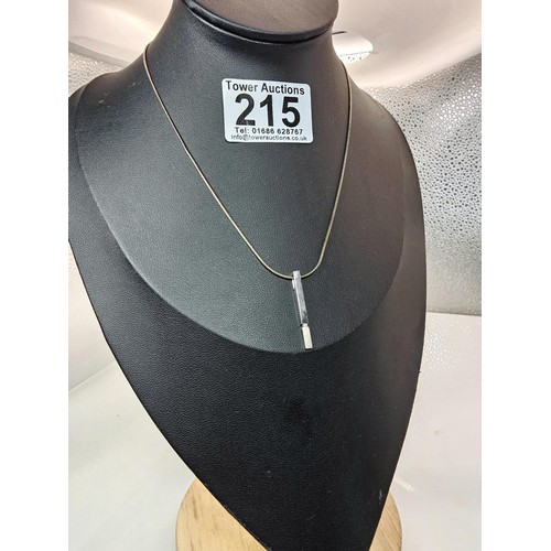 215 - A 925 silver pendant necklace featuring a bar formed silver pendant set with a real round cut diamon... 